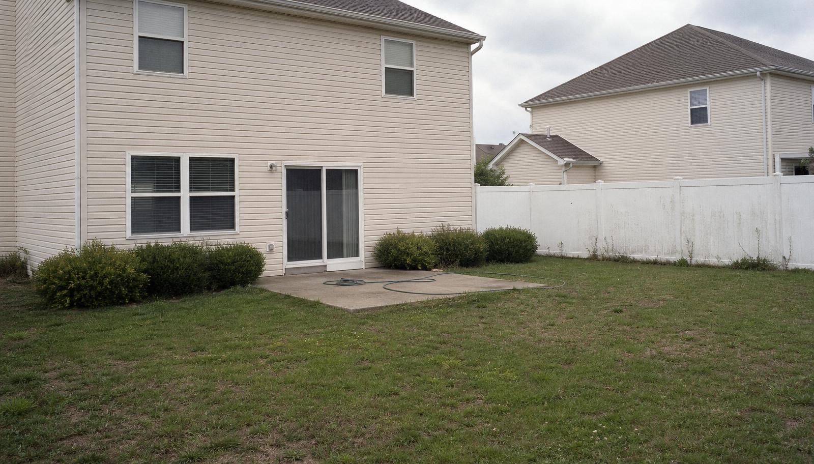 Original suburban Indiana backyard before landscape design-build project